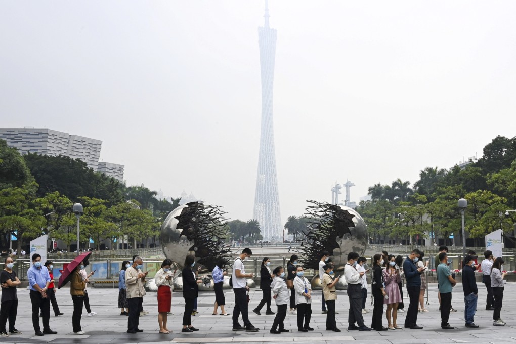 People queue for Covid-19 testing at Flower City Square in Guangzhou. Photo: Reuters