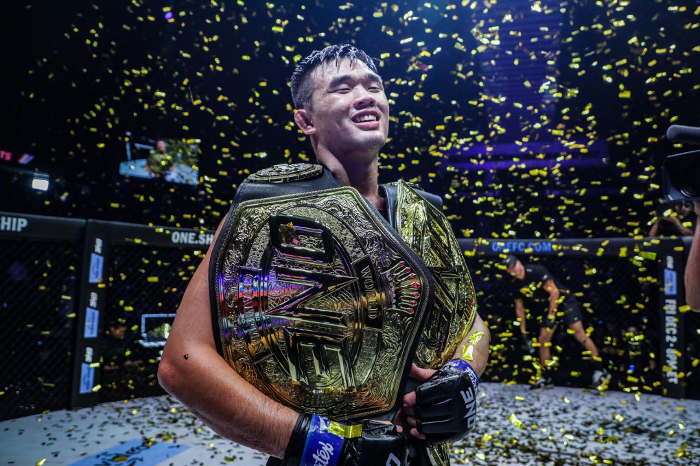Christian Lee celebrates with his two titles. Photos: ONE Championship