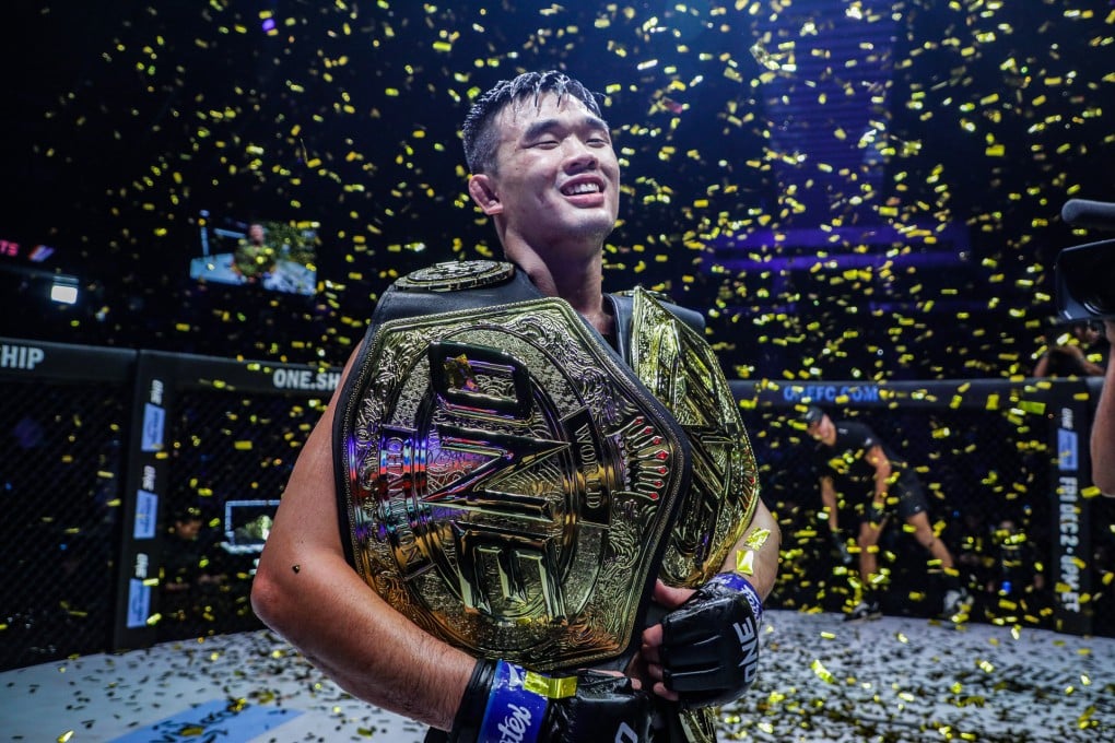 Christian Lee celebrates with his two titles. Photos: ONE Championship