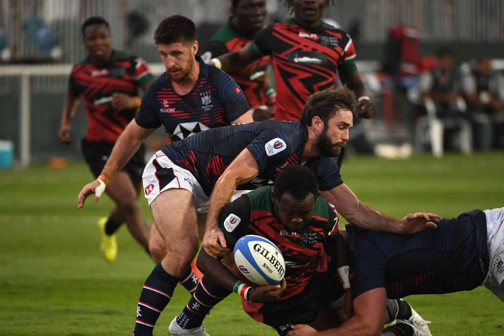 Samuel Asati of Kenya is tackled by Sean Taylor (left) of Hong Kong during the RWC 2023 Final Qualification Tournament at The Sevens Stadium on November 18, 2022 in Dubai. Photo: World Rugby via Getty Images