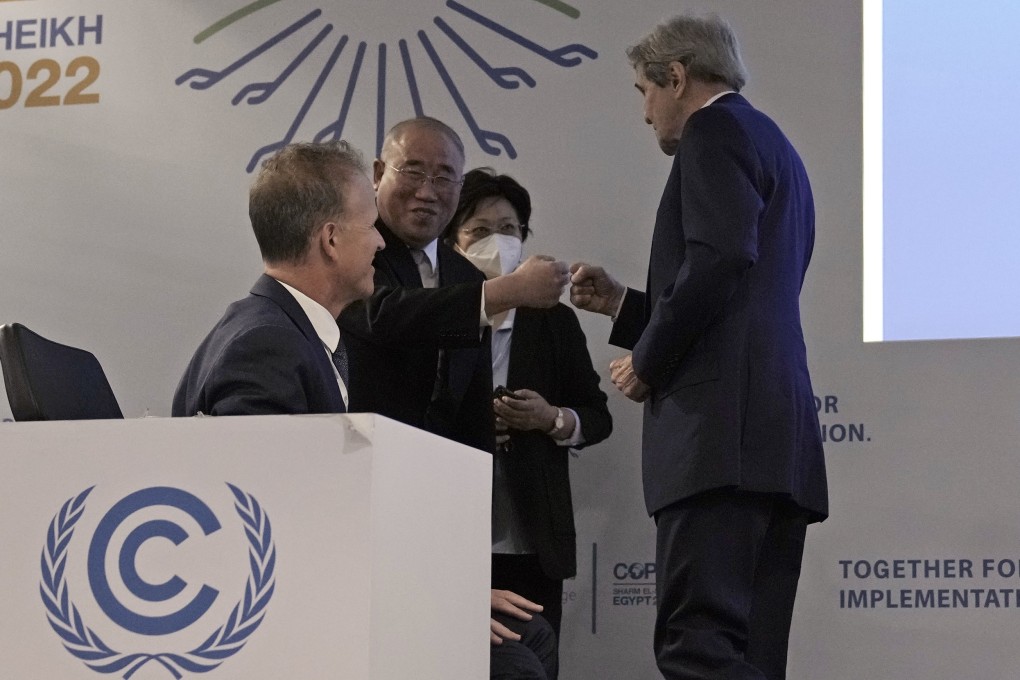 Xie Zhenhua and John Kerry greet each other at the COP27 UN Climate Summit, in Sharm el-Sheikh, Egypt. Photo: AP