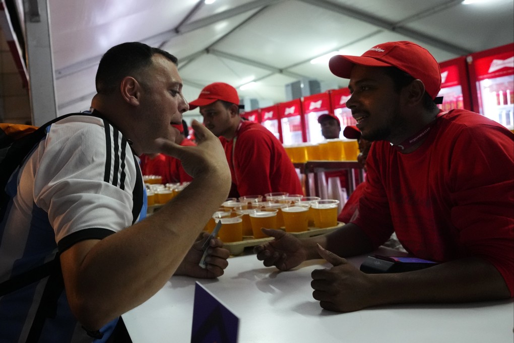 A fan order beers at a fan zone ahead of the Fifa World Cup in Doha, Qatar on Saturday. Photo: AP