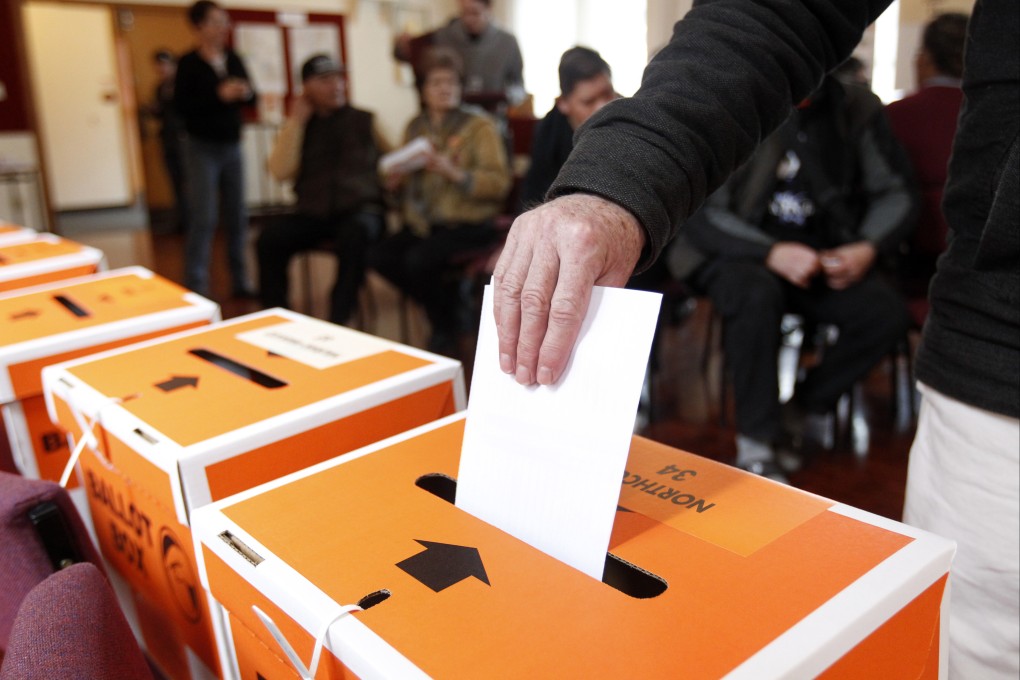 A voter casts their ballot in Auckland in 2014. New Zealand’s Supreme Court has found in favour of a lobby group seeking to lower the country’s voting age from 18 to 16. Photo: New Zealand Herald via AP