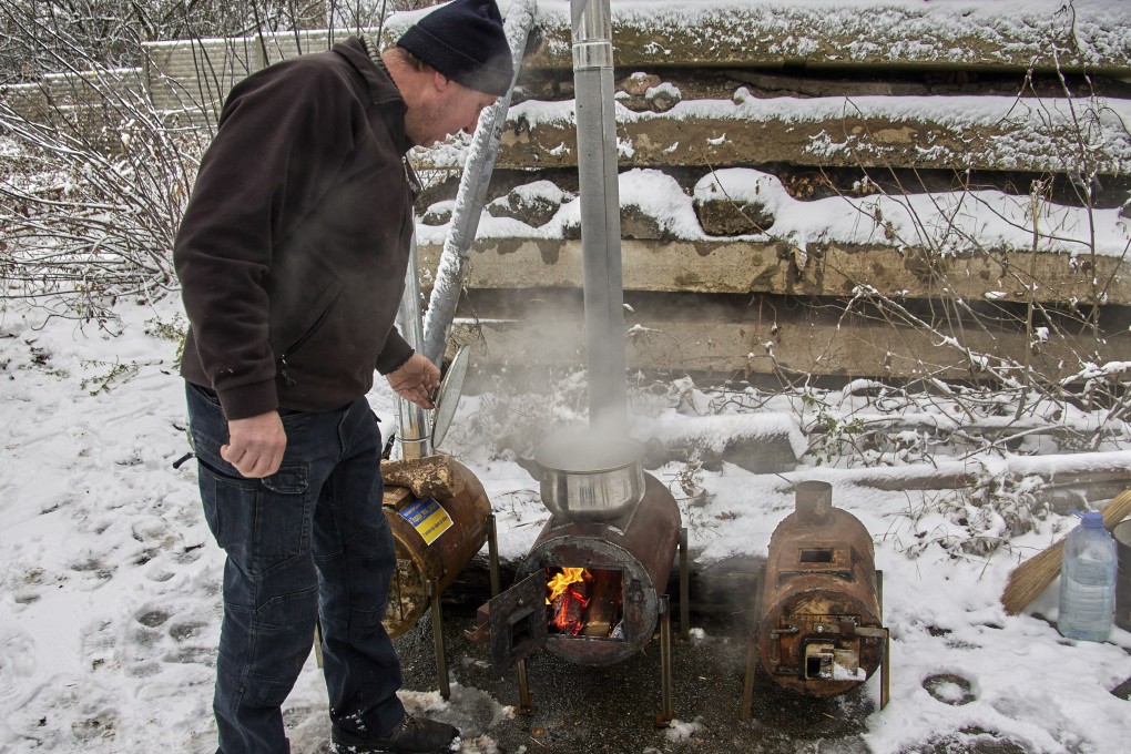 Two brothers, Gennady and Yuriy, founders of the volunteer organization ‘Give Warmth to a Soldier’, have been making potbelly stoves for the Ukrainian army. Photo: EPA-EFE