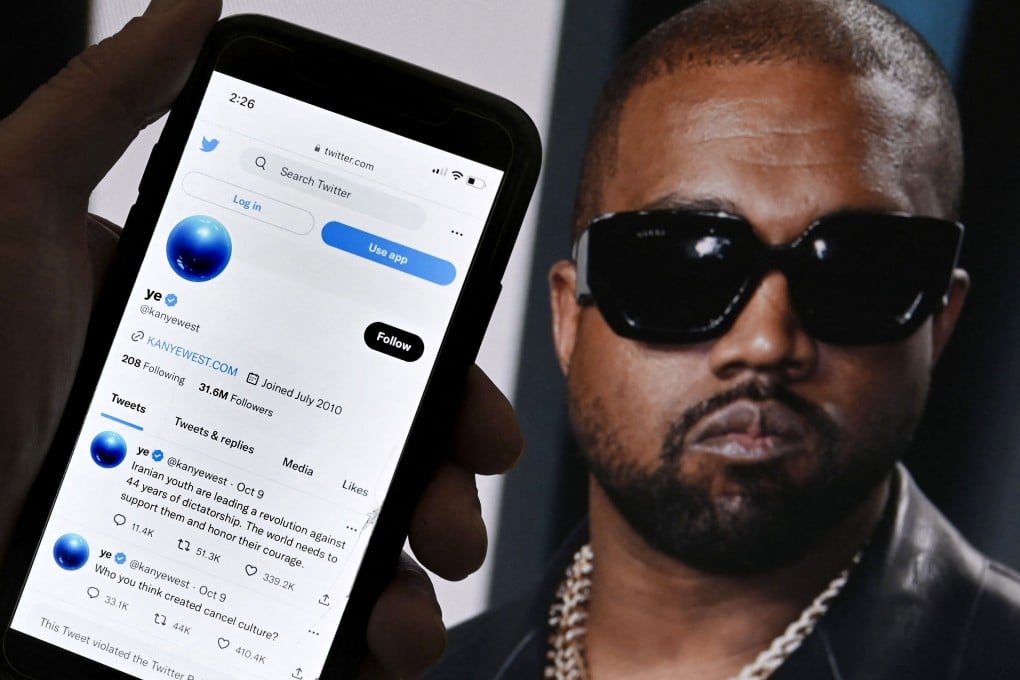 In this photo illustration, the Twitter account of Kanye West is Rapper Kanye West’s Twitter account, which was temporarily locked out after posting anti-Semitic remarks, appeared to be back up on the platform after billionaire Elon Musk took ownership of the social media company. Photo: AFP/File