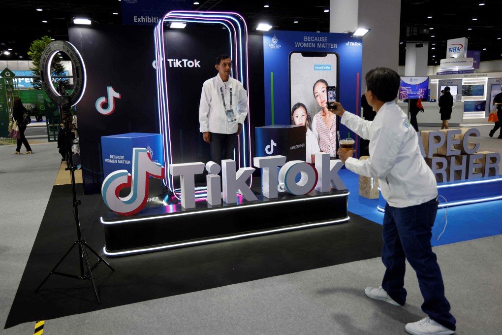 A man poses at the TikTok booth at the international media centre during the Asia-Pacific Economic Cooperation (APEC) summit in Bangkok on Friday. Photo: AFP