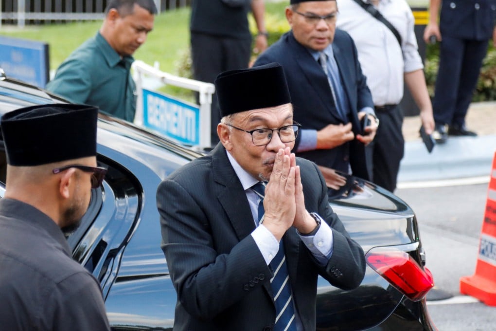 Malaysia’s opposition leader Anwar Ibrahim attends a news conference outside the National Palace in Kuala Lumpur on Tuesday. Photo: Reuters.