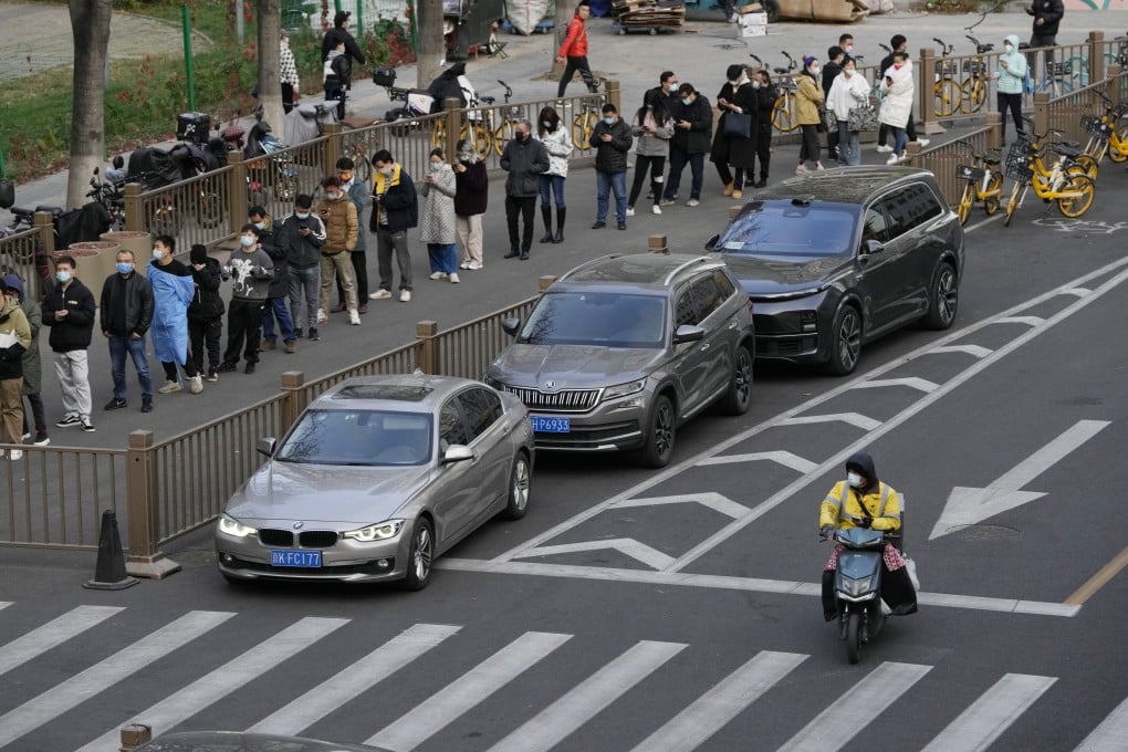 Residents line up for Covid-19 tests in Beijing on November 21. Daily cases have surged in China and frequent testing has resumed, soon after the government relaxed quarantine requirements for close contacts and overseas travellers on November 11. Photo: AP