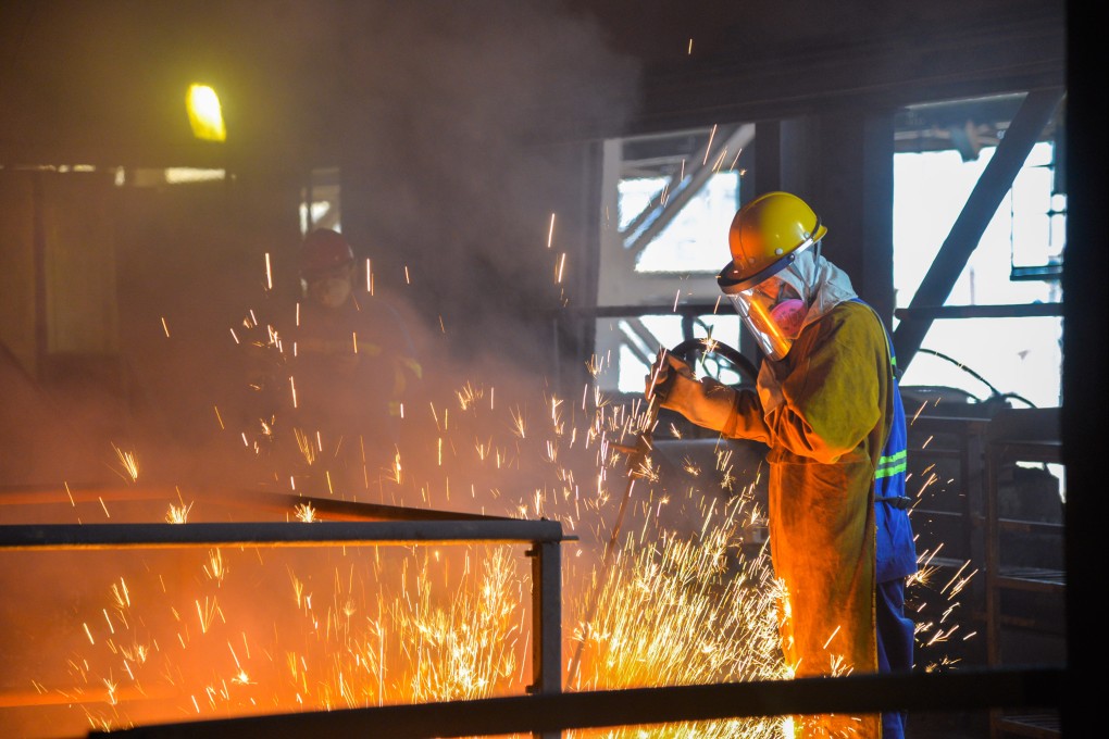 A nickel production worker in Indonesia. Photo: Xinhua