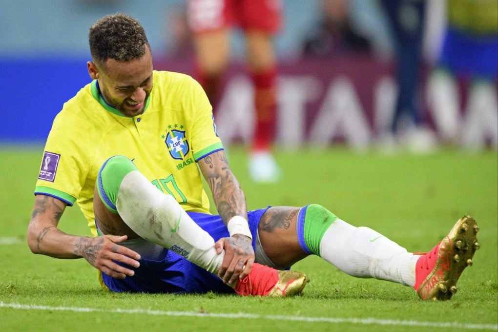 Brazil’s Neymar grabs his ankle after an injury during the World Cup group G match against Serbia at the the Lusail Stadium in Qatar. Photo: AP