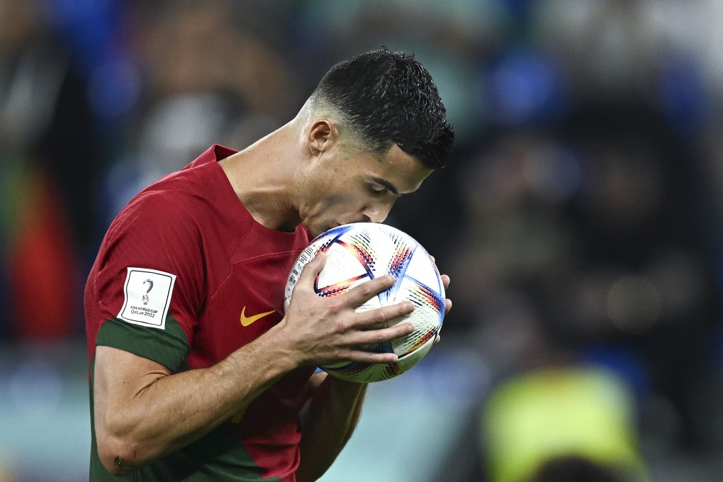 Portugal’s Cristiano Ronaldo kisses the ball before a penalty kick during the Group H match between Portugal and Ghana in Doha on Thursday. Photo: Xinhua