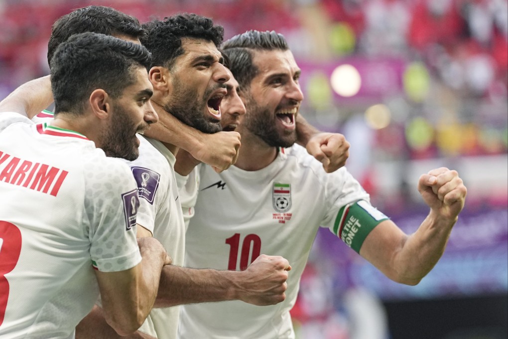 Iran’s players celebrate after the World Cup group B match against Wales. Photo: AP