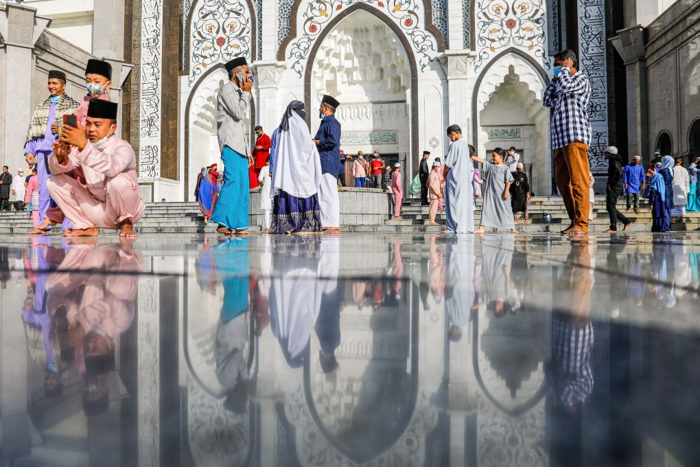 People walk around after participating in Eid al-Fitr prayers in Kuala Lumpur. Political Islam has been a mainstay in Malaysian politics since the country’s independence from Britain in 1957. Photo: EPA-EFE