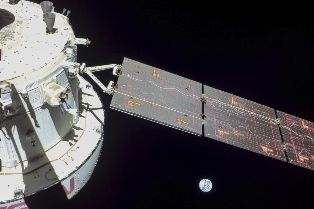 Nasa’s Orion spacecraft is seen looking back at the Earth from a camera mounted on one of its solar arrays. Image: Nasa via AP