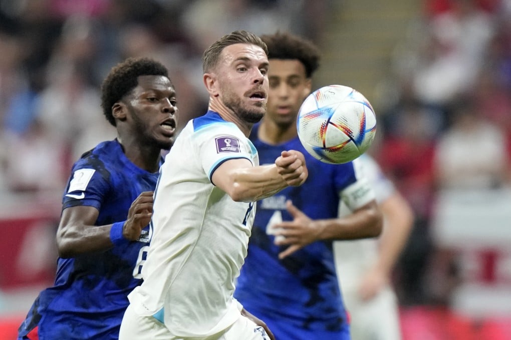 England’s Jordan Henderson vies for the ball. Photo: AP