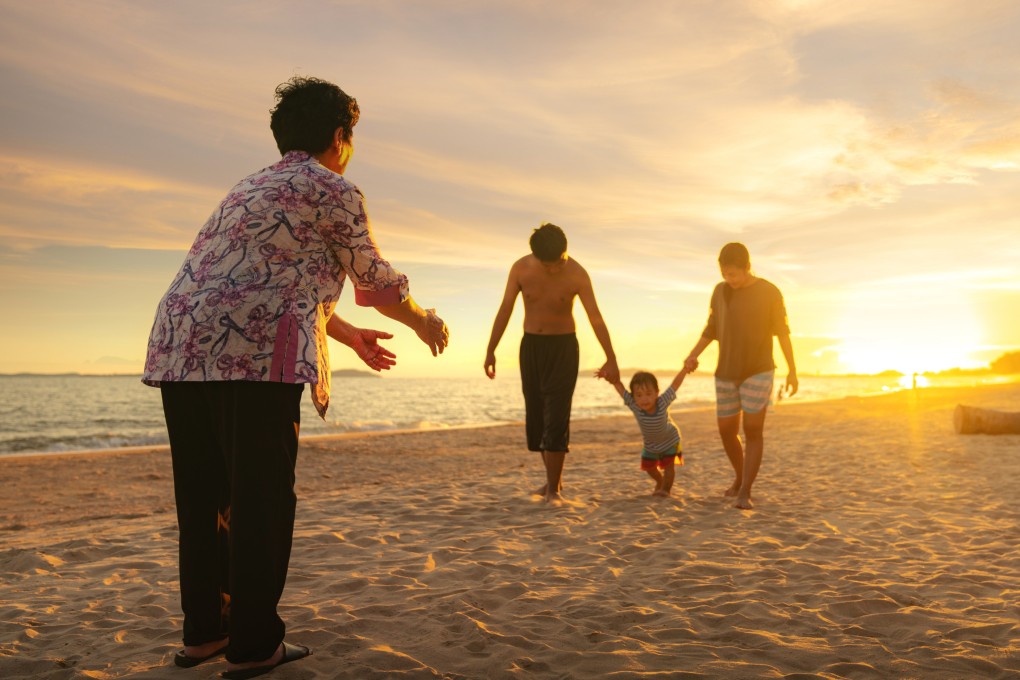 A family play together on Phuket beach, Thailand. Photo: Shutterstock/File