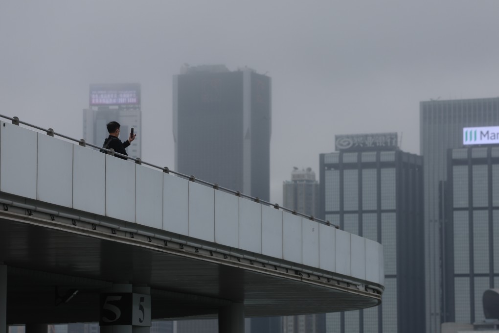 Foggy weather makes for a gloomy view of Victoria Harbour from the Tsim Sha Tsui waterfront on November 25, 2022. Photo: SCMP / Edmond So