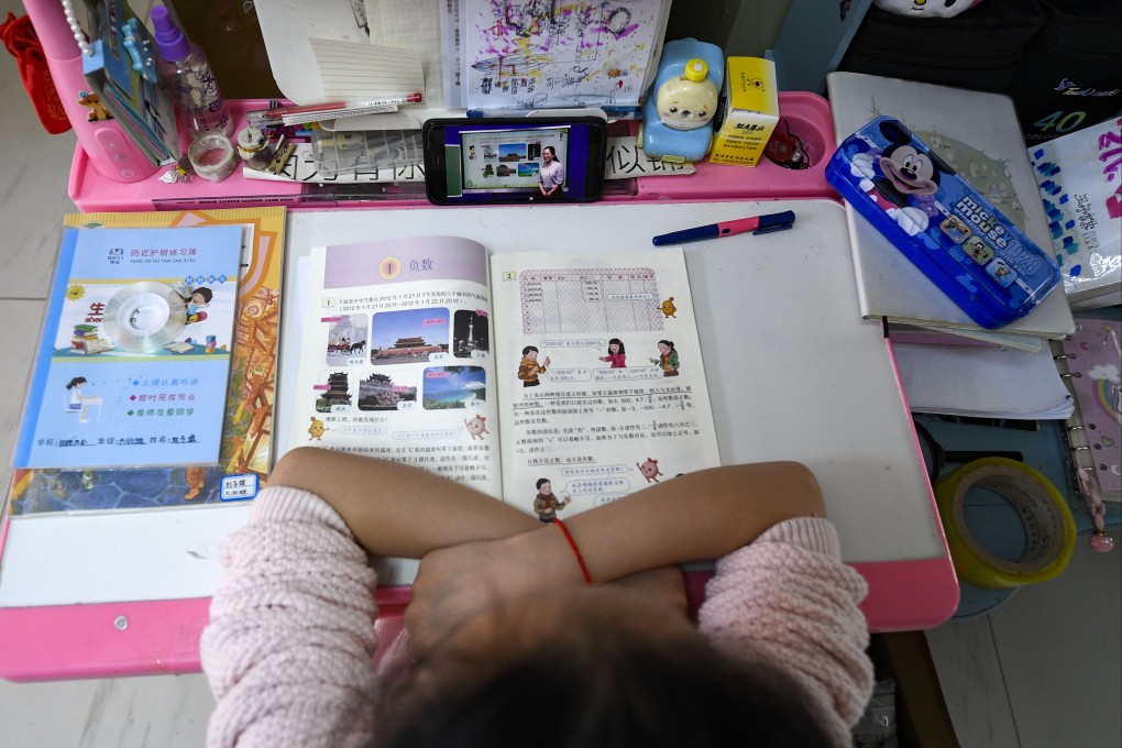 A student reads a math textbook written in Chinese. Tencent and Alibaba’s AI models have scored better than humans on a set of language processing tasks. Photo: Xinhua