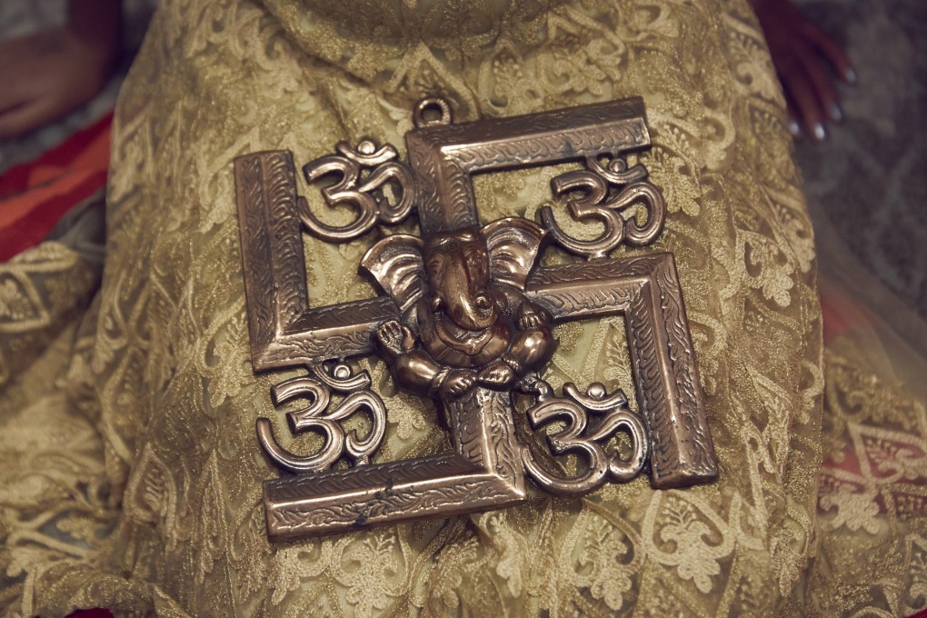 A Hindu swastika symbol is considered one of peace and prosperity. Photo: AP