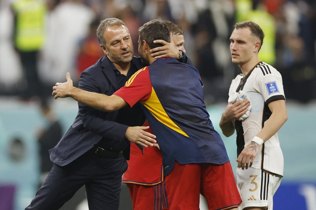 Germany coach Hansi Flick embraces a Spain player after the Sunday’s Fifa World Cup match. Photo: Reuters