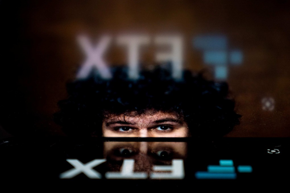 The logo of the crypto trading firm FTX is reflected in an image of former chief executive Samuel Bankman-Fried. The collapsed company suffered a “complete failure of corporate controls” under Bankman-Fried, the company’s new chief executive said on November 17, calling the situation “unprecedented”. Photo: AFP