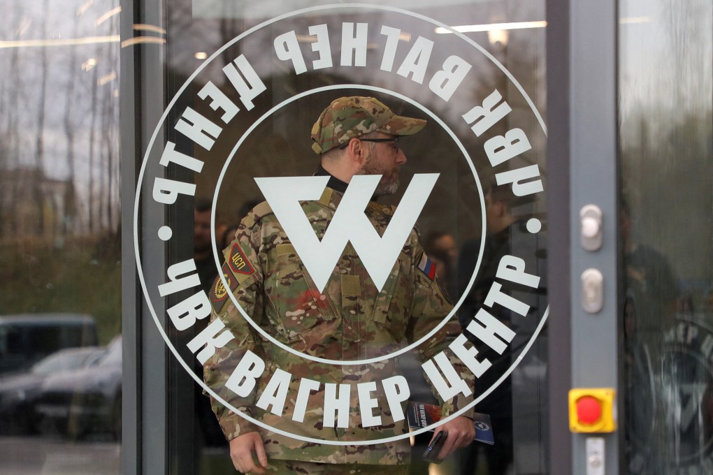 A man wearing a camouflage uniform walks out of PMC Wagner Centre, in St Petersburg, Russia. File photo: Reuters