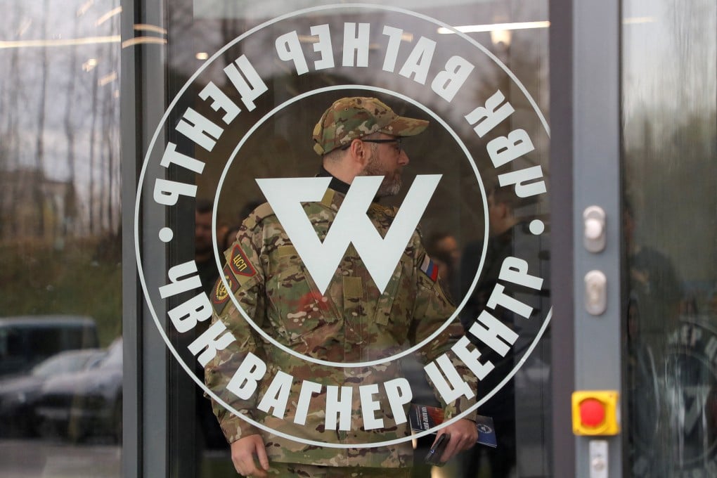 A man wearing a camouflage uniform walks out of PMC Wagner Centre, in St Petersburg, Russia. File photo: Reuters