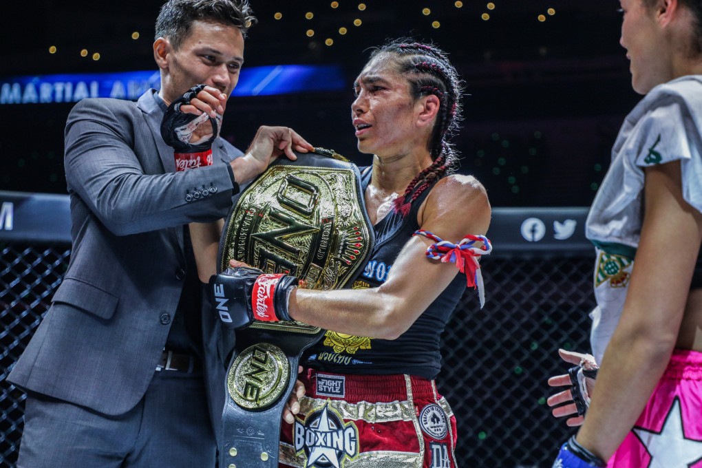 Janet Todd celebrates after winning the interim atomweight Muay Thai title at ONE 159 in Singapore. Photo: ONE Championship