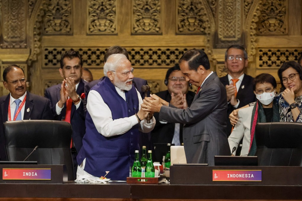Indonesian President Joko Widodo (right) passes the gavel to Indian Prime Minister Narendra Modi in a handover ceremony during the Group of 20 Leaders’ Summit in Bali, Indonesia, on November 16. India begins its G20 presidency on December 1. Photo: EPA-EFE