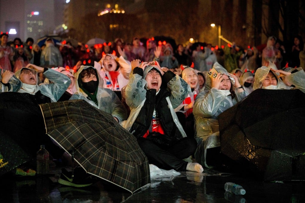 South Korean fans react as they attend a public screening in Seoul on November 28 that saw Ghana edge past South Korea 3-2 at the Education City Stadium in Qatar. Photo: AFP
