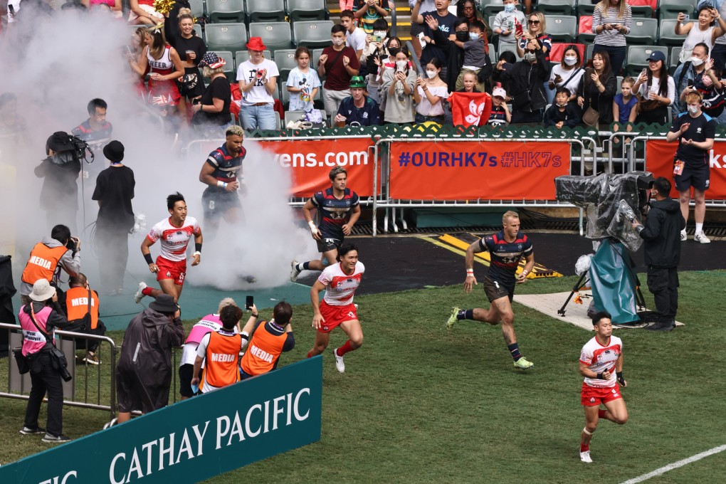 Japan and Hong Kong players run onto the pitch at the 2022 Cathay Pacific/HSBC Hong Kong Sevens. Photo: K. Y. Cheng