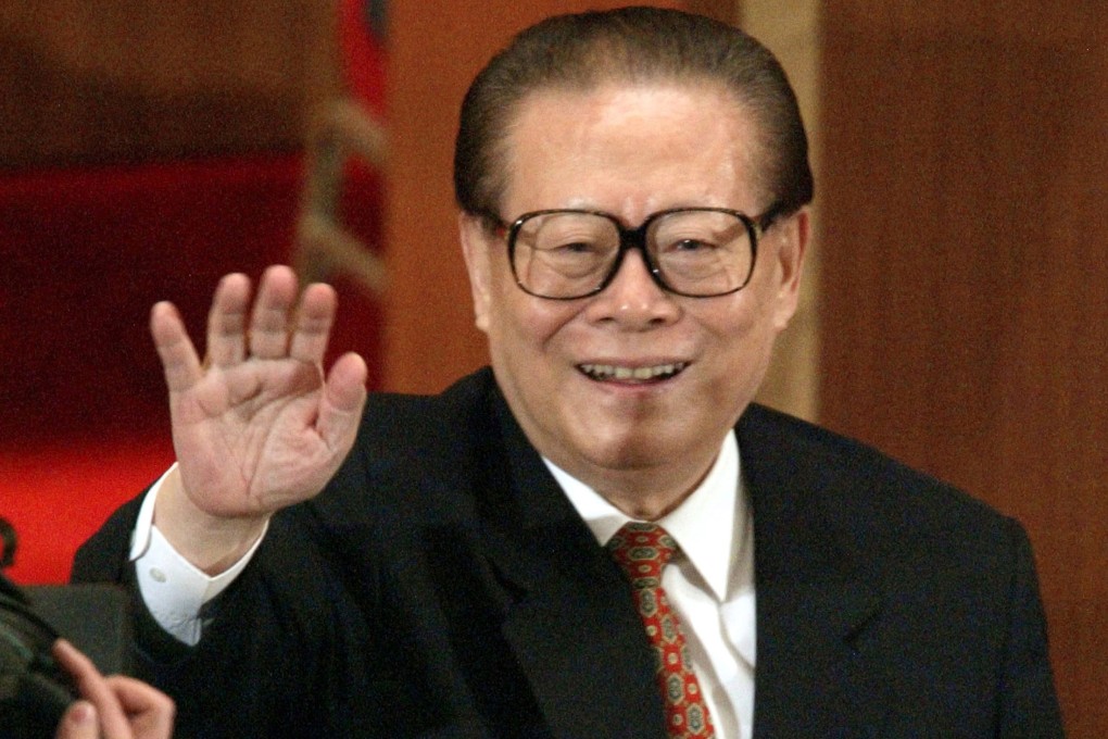 Jiang Zemin waves after being re-elected as chairman of the Central Military Commission in Beijing on March 15, 2003. Photo: Reuters