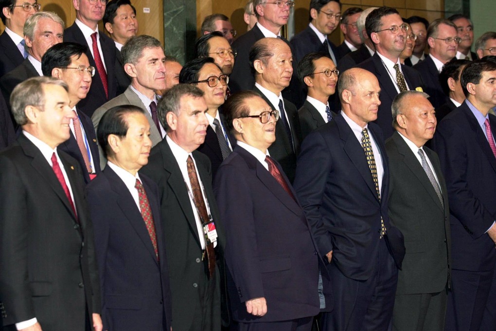 Then-president Jiang Zemin (front row, centre) and chief executive Tung Chee-hwa (front row, second from right) take part in a photo session with delegates at the Fortune Global Forum on May 8, 2001, at the Hong Kong Convention and Exhibition Centre. Photo: Handout