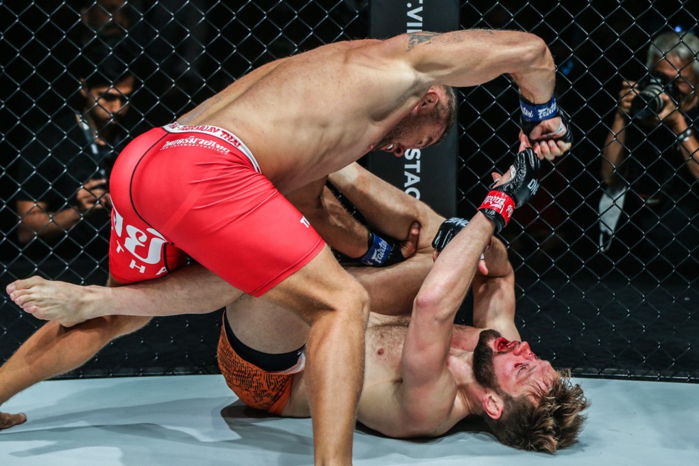 Anatoly Malykhin delivers hammer fists to finish Reinier de Ridder. Photos: ONE Championship