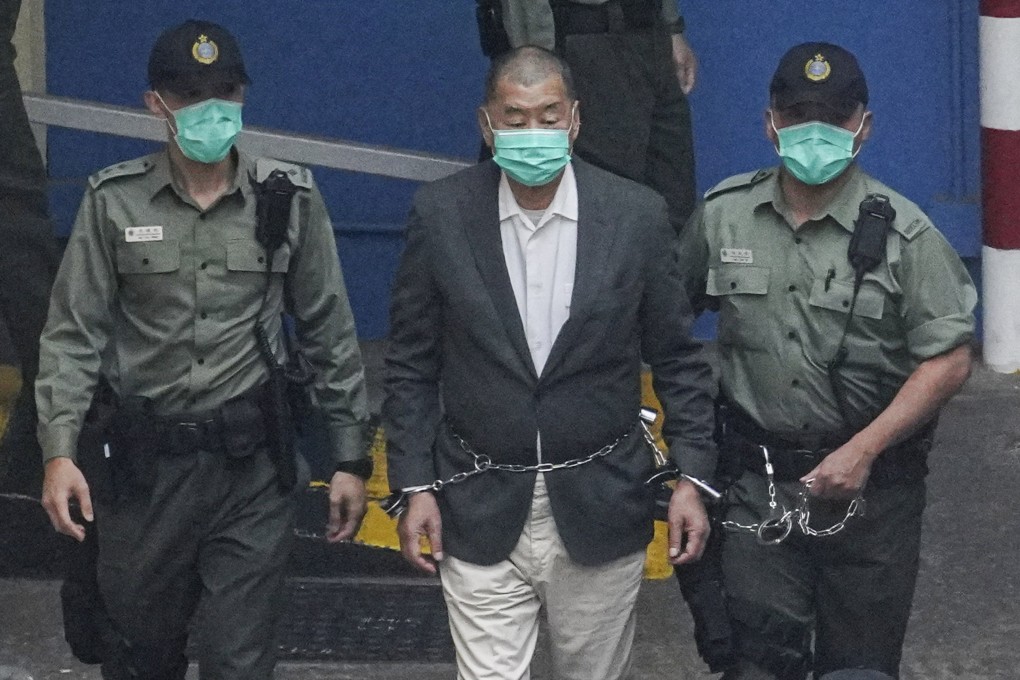 Apple Daily founder Jimmy Lai being escorted by correctional services officers in 2020. Photo: Winson Wong