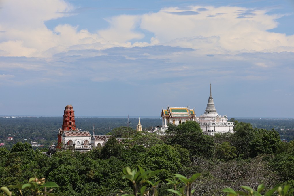 Khao Wang, or “palace hill”’ in Phetchaburi, Thailand, with its former royal retreat, rises above the flat surrounding plain. The city, on the site of a Khmer Empire outpost, has ruins of a temple from that era, and sacred caves. Photo: Thomas Bird
