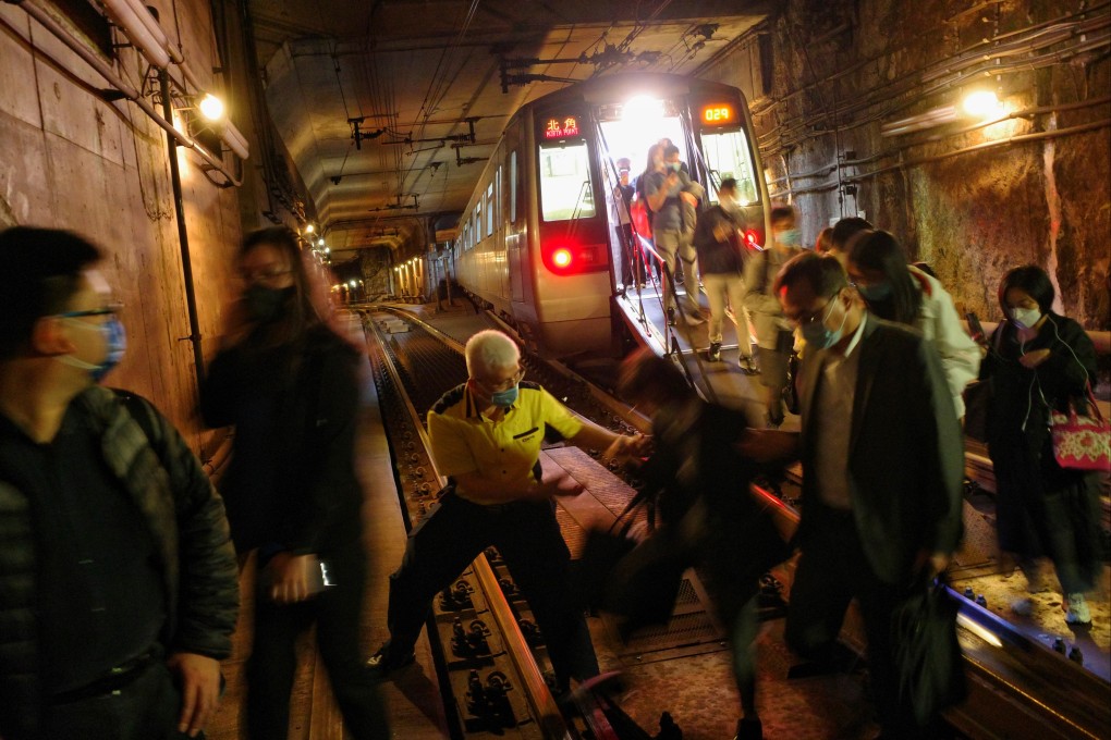 Commuters leave an MTR train and walk to Tseung Kwan O station. Photo: Sun Yeung
