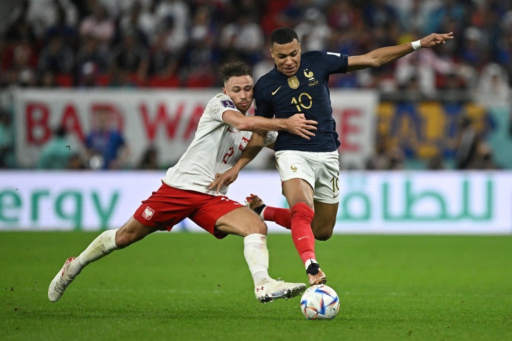 France’s Kylian Mbappe in action with Poland’s Matty Cash during the Fifa World Cup in Doha, Qatar on Sunday. Photo: Reuters