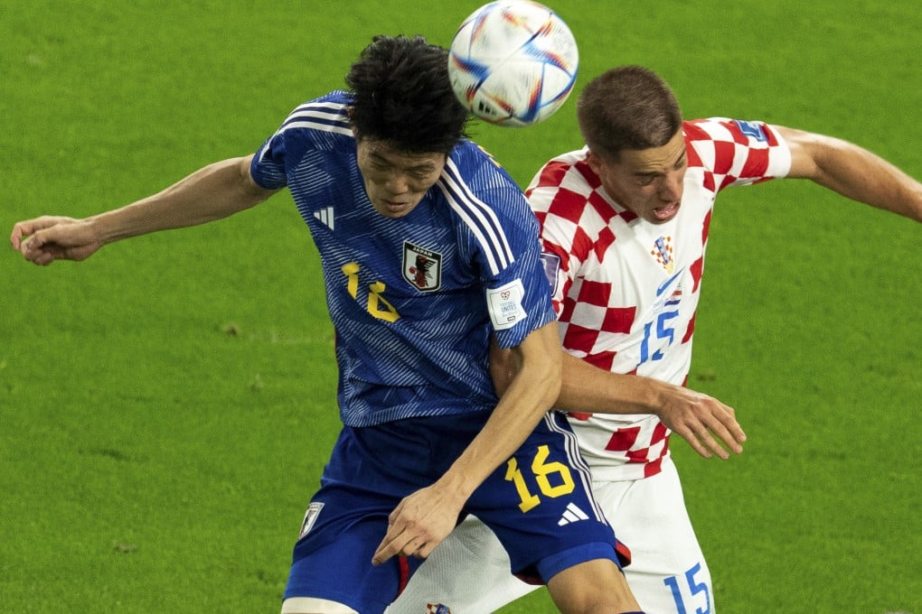Japan’s Tomiyasu Takehiro vies for the ball with Croatia’s Mario Pasalic of Croatia during extra time in the round of 16 match at Al Janoub Stadium in Al Wakrah, Qatar on Monday. Photo: Xinhua