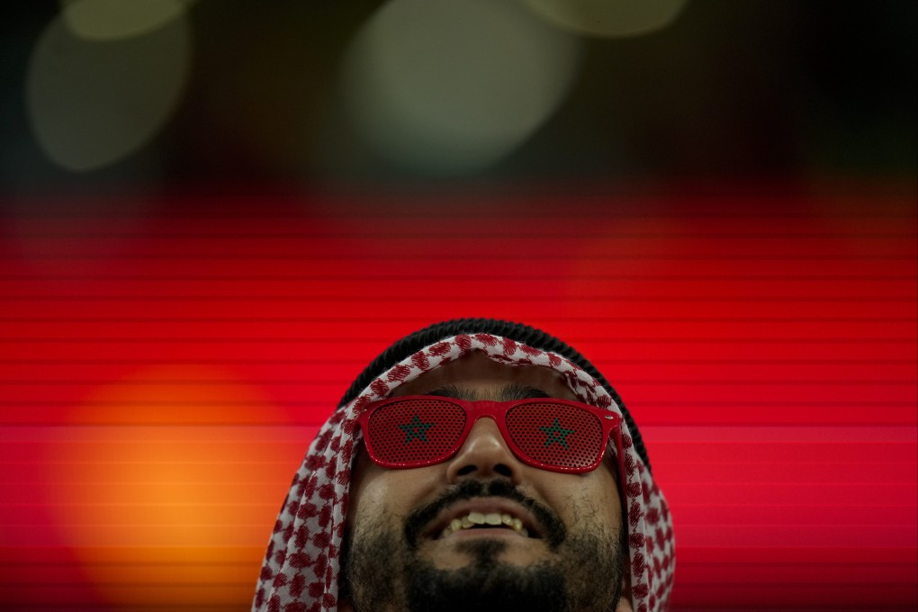 A fan supporting Morocco poses prior to its knock-out match against Spain. Photo: AP