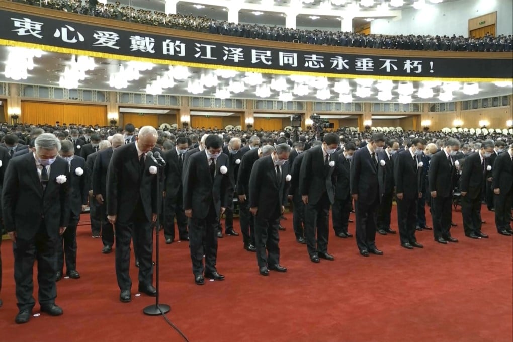 Xi Jinping leads other officials to bow during a formal memorial for the late former Chinese President Jiang Zemin at the Great Hall of the People in Beijing on Tuesday. Screengrab: CCTV via AP