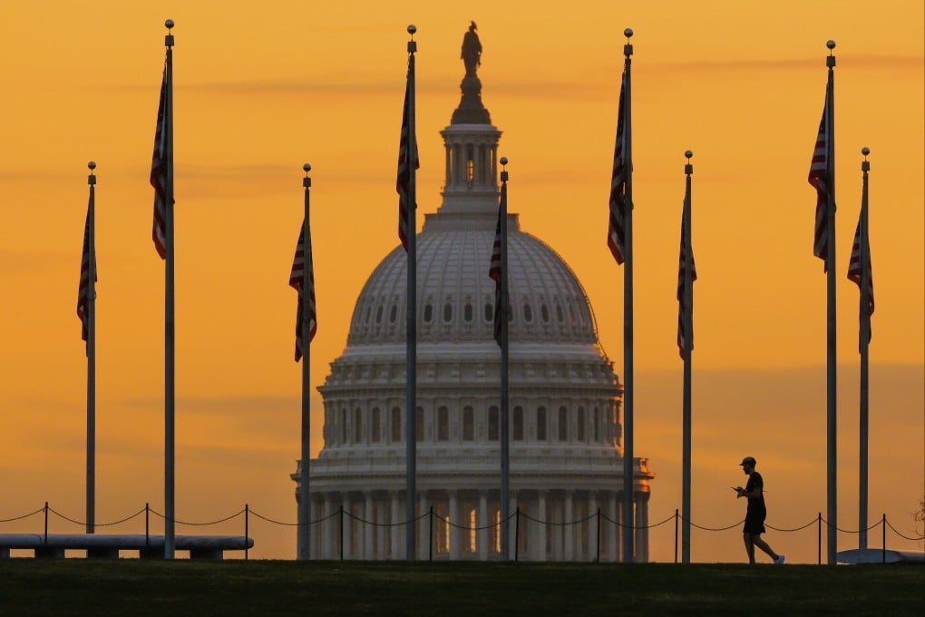 US flags are seen on the National Mall in Washington, with the US Capitol behind, at sunrise on November 7, 2022. Photo: AP