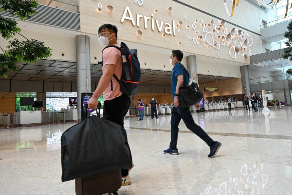 Passengers walk toward an immigration checkpoint at Changi International Airport Terminal 4 in Singapore. Since the start of the pandemic, drug traffickers are increasingly attempting new ways to smuggle drugs into Singapore, the Central Narcotics Bureau said. Photo: AFP