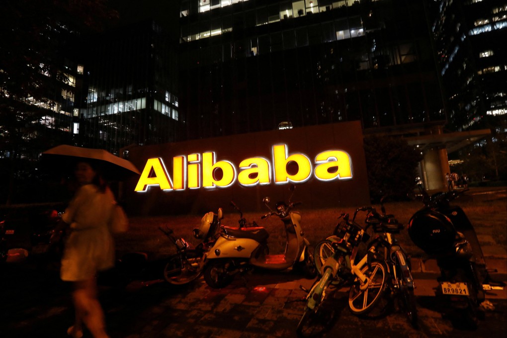 The logo of Alibaba is seen lit up at its office building in Beijing. Photo: Reuters