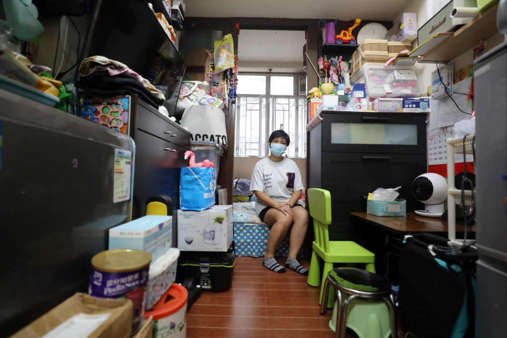 A woman in the 150 sq ft flat in Sham Shui Po she lives in with her husband and daughter. Photo: Xiaomei Chen