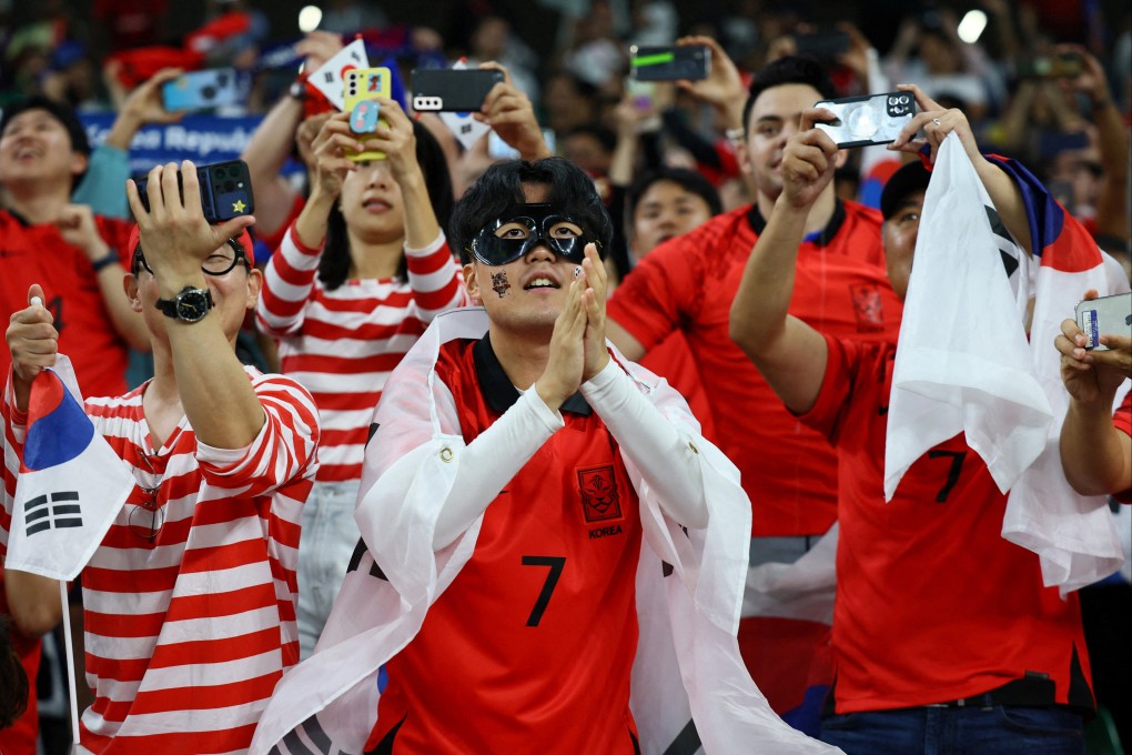 South Korea fans celebrate in the stands. Photo: Reuters