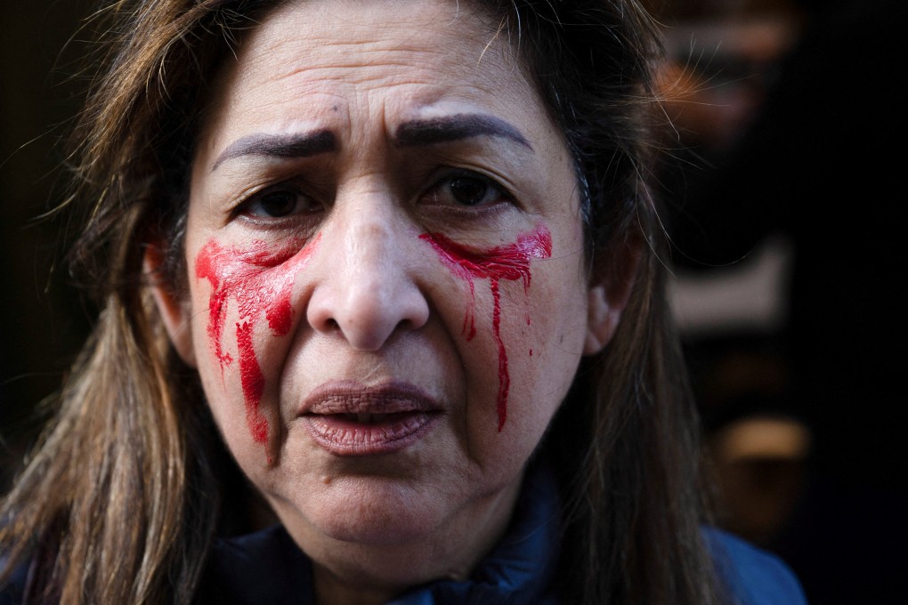 A woman in the US participates in a protest against gender-based violence in Iran. Photo: Reuters