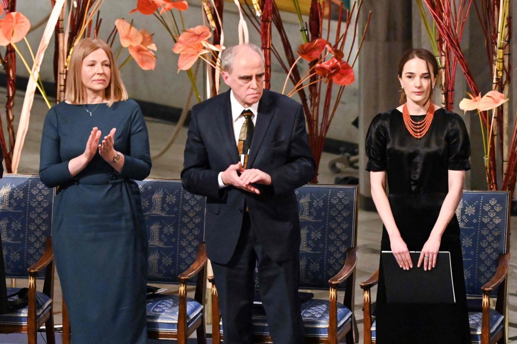 Natalia Pinchuk, left, on behalf of her husband, jailed Belarusian activist Ales Bialiatski, and chairman Yan Rachinsky on behalf of Russian human rights organisation Memorial, centre, applaud after Nobel Peace Prize 2022 winner and Head of the Ukrainian Centre for Civil Liberties, Oleksandra Matviichuk, right, delivered her speech during the awards ceremony in Norway. Photo: AFP