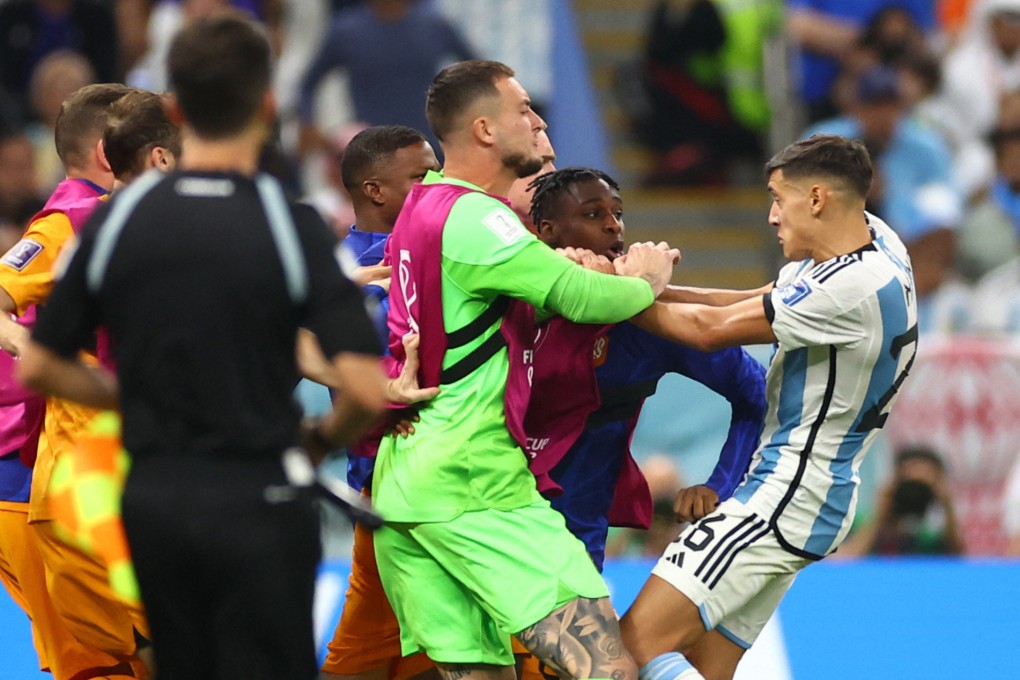 Argentina’s Nahuel Molina clashes with Netherlands players in Lusail, Qatar on Friday. Photo: Reuters