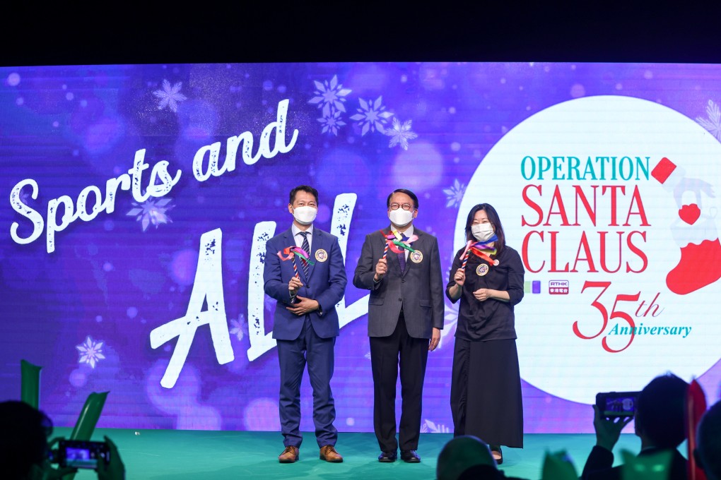 Director of Broadcasting Eddie Cheung (left), Chief Secretary Eric Chan and Mabel Sieh, the Post’s director of corporate social responsibility at the 35th anniversary ceremony of Operation Santa Claus. Photo: K. Y. Cheng